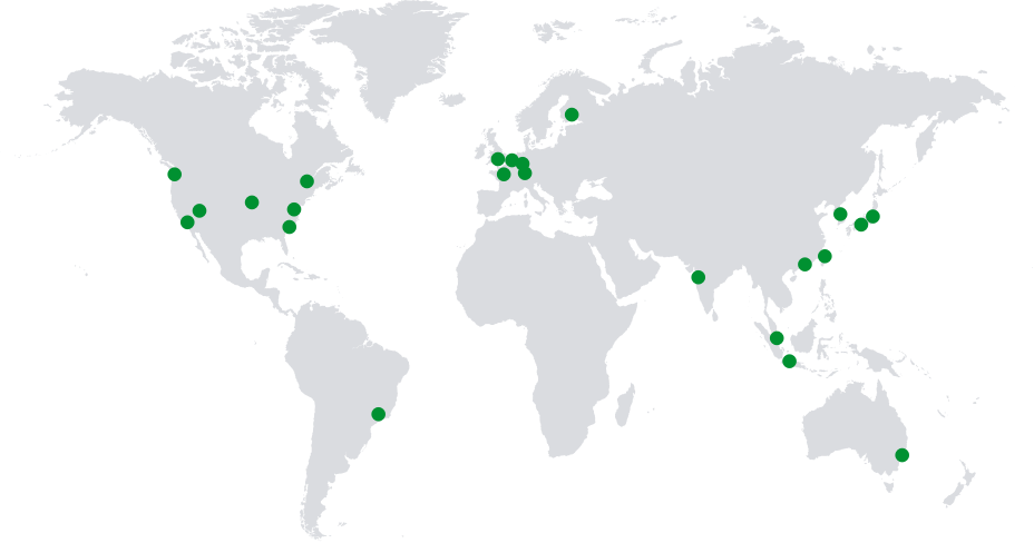 World map with green dots depicting regional centers and global coverage.