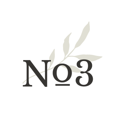 A circular logo with a white background, featuring the text 'No 3' and a light gray, leafy branch design.