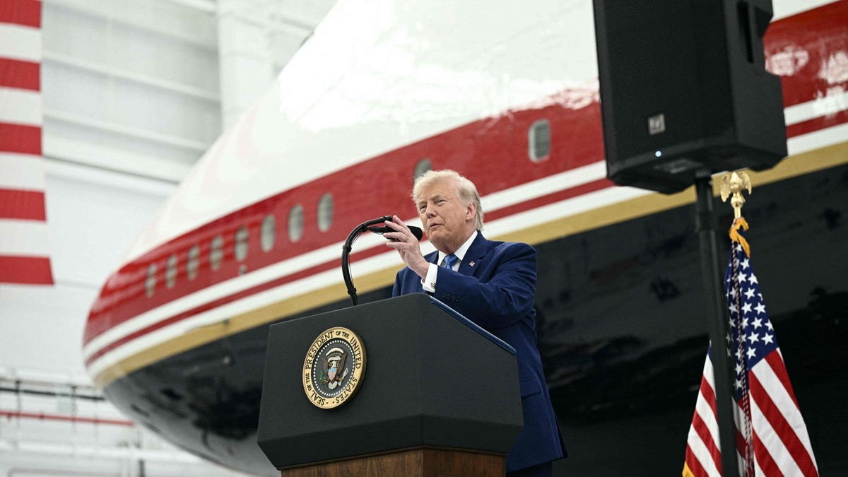 US President Donald Trump speaks in front of the new Air Force One, gifted to him by by Qatar, in a hangar at Joint Base Andrews in Maryland on June 19, 2026. White House officials bade farewell on June 18, 2026 to one of the two jets that have been used to transport US presidents for more than 30 years. The goodbye messages fueled speculation that a Boeing 747 controversially gifted to President Donald Trump by the Gulf emirate of Qatar is now due to enter service. Trump will be heading to Joint Base Andrews before spending the weekend at Camp David. (Photo by Brendan SMIALOWSKI / AFP) US President Donald Trump departs White House for Camp David