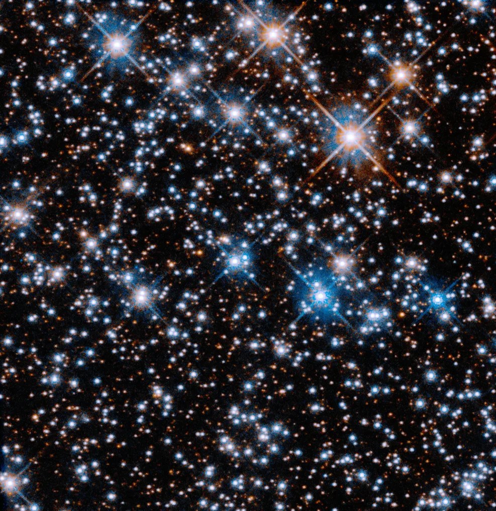 The cross-shaped effect seen on some stars in Hubble images are "diffraction spikes," caused by light reflecting off the structure of the telescope.
