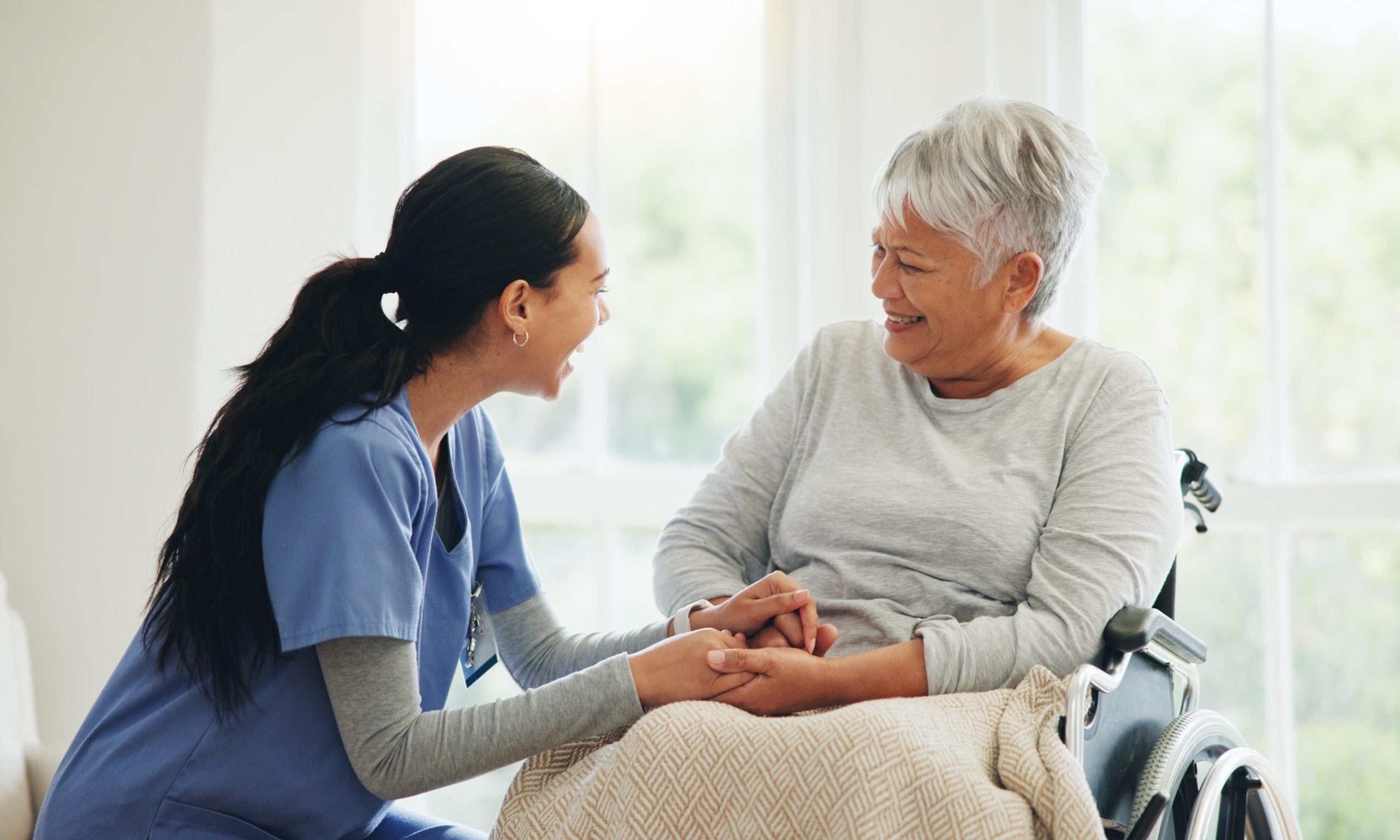 Doctor talking to older adult about her medical condition