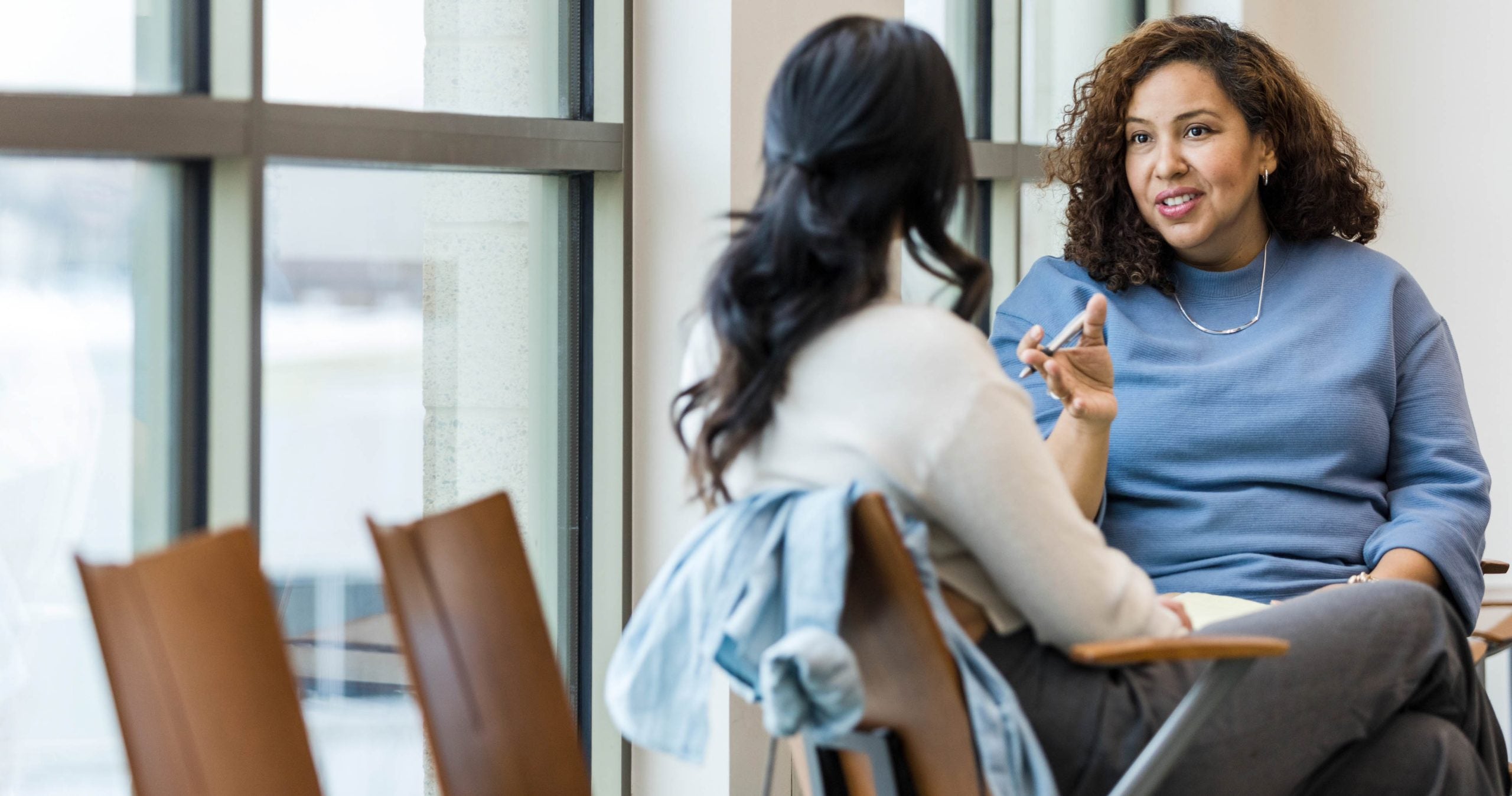 Social worker listens to client