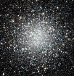 Thousands of white-ish dots scattered on a black background, strongly concentrated towards the center
