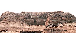 Low ruins in the desert, looking like a wall