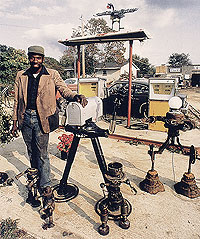 William Clarke with some of his robot sculptures