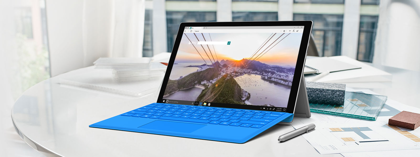 Surface Pro computer on a desk, showing a video playing in a Microsoft Edge browser