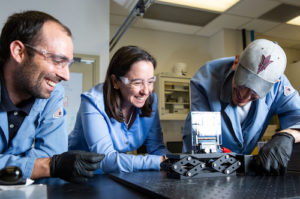 Three people in lab attire