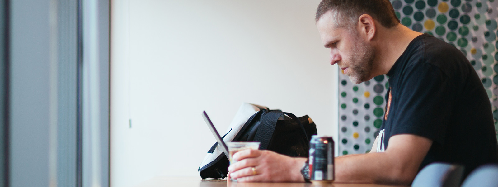 A man sitting at a desk working on his Windows 10 computer