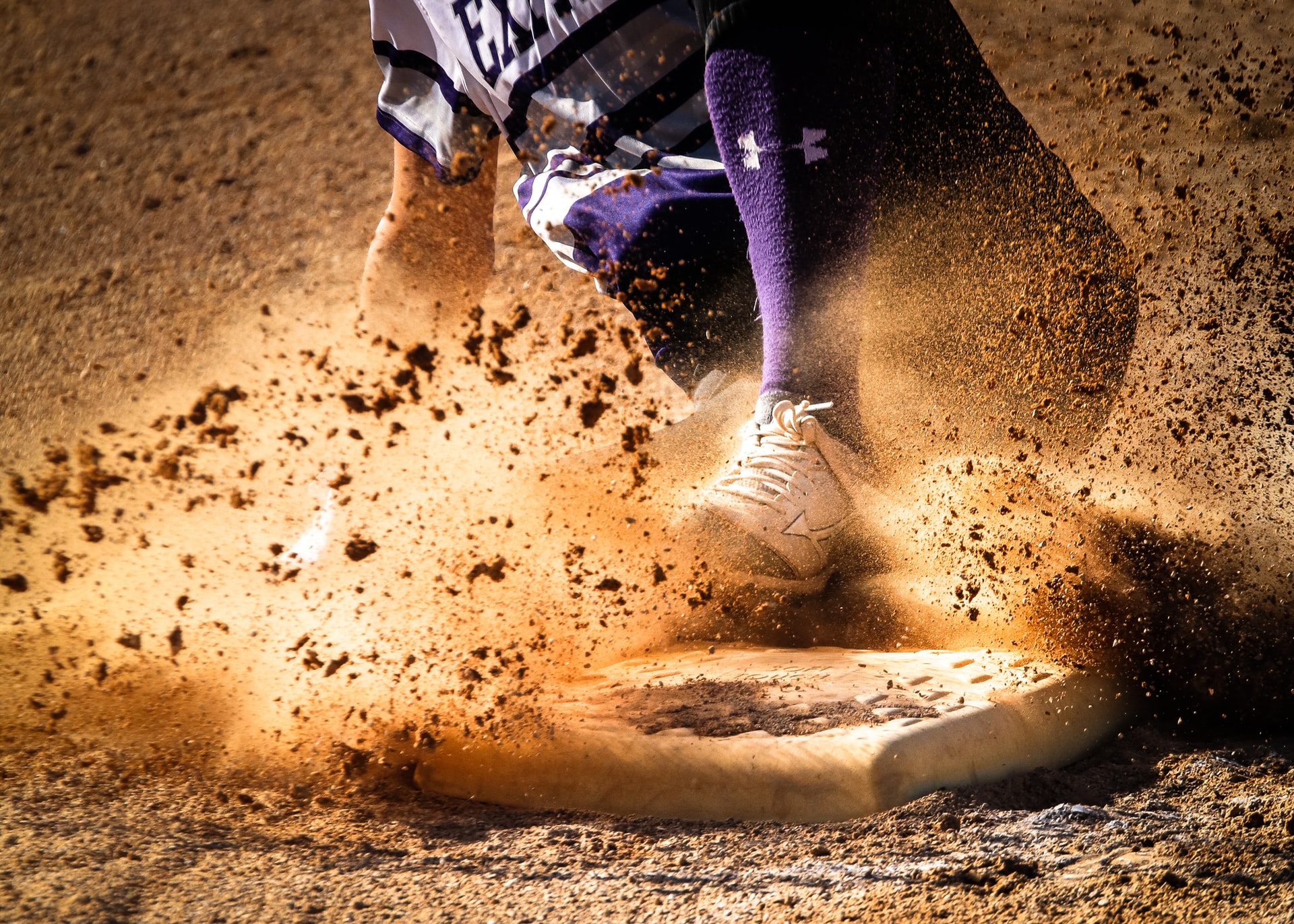 batter sliding onto base