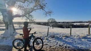 A cyclist on a snowy track