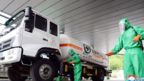 A photo released by the official North Korean Central News Agency (KCNA) on 19 May 2022 shows staff disinfecting the premises of a medical oxygen factory to curb the current coronavirus disease health crisis in Pyongyang, North Korea