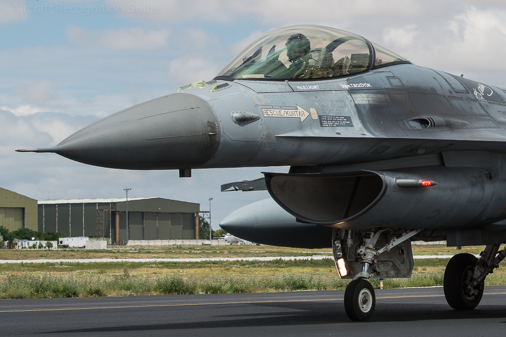 Photo of the forward fuselage of the F-16, showing the bubble canopy and typical 'smile' air intake (of which two versions exist). Note that the canopy consists of two pieces. Image