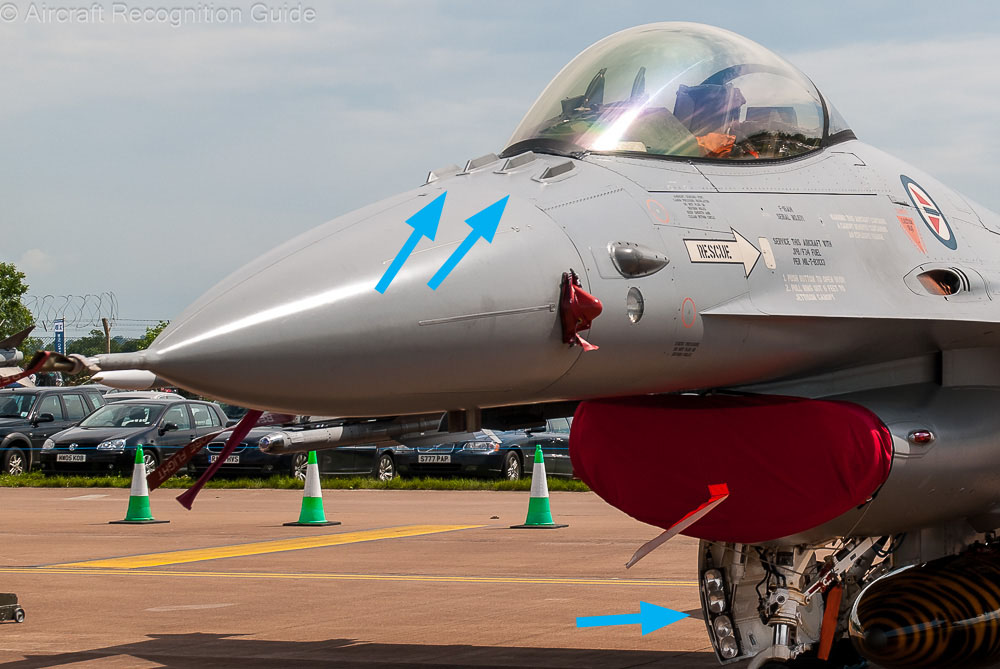 Externally, you can best distinguish the F-16AM (F-16 Block 20) from earlier versions by the four IFF antennas on top of the nose and landing lights attached to the nose gear door. Image