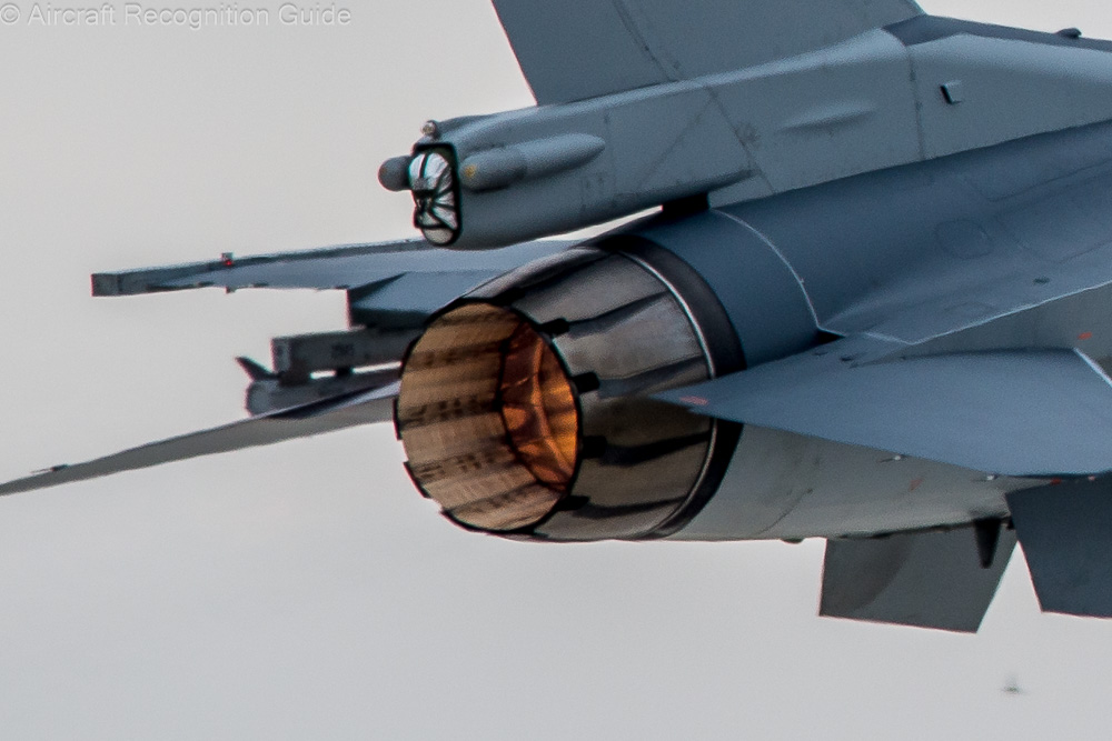 At the rear of the Block 30 F-16C you can see that the petal plates of the exhaust of the GE engine are wider, shorter and more curved than on the P&W above. Image
