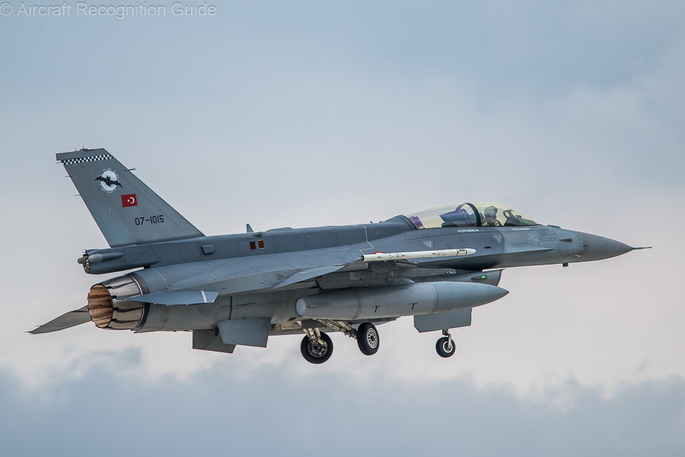 A Block 50+ F-16D clearly showing the stretched, wide dorsal fin or spine running between the tail and canopy. Image