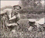 Soldiers working in field