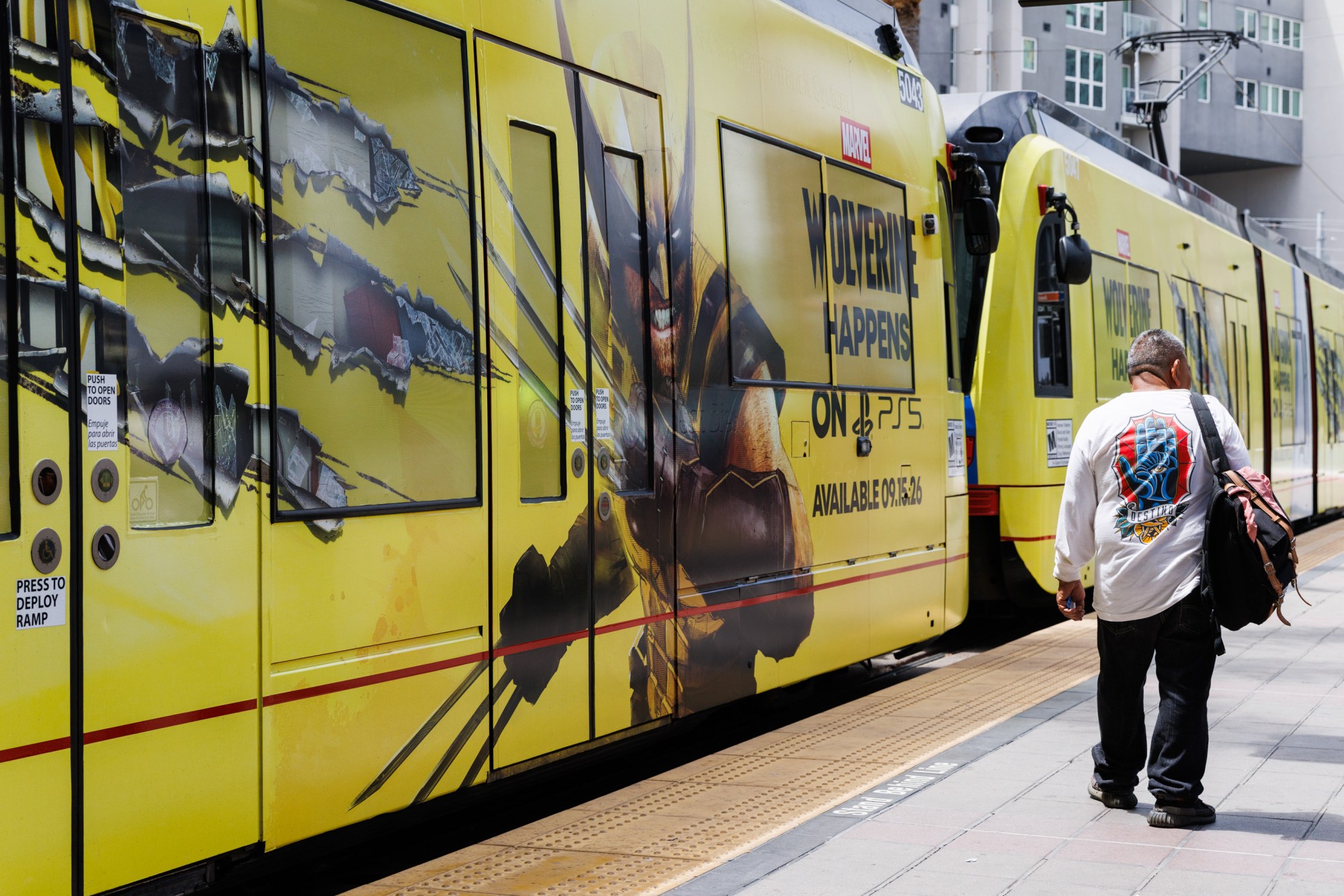 SUT-L-TROLLEY-001 A trolley wrapped with an advertisement for the upcoming Wolverine video game arrives in downtown San Diego. (Kristian Carreon / The San Diego Union-Tribune)